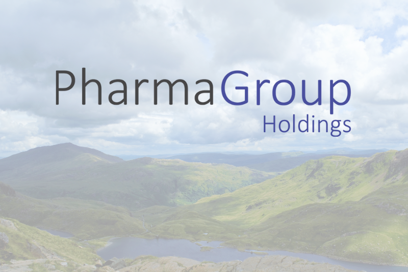 Image shows the Pharma Group Holdings logo with a scenic background of green hills
